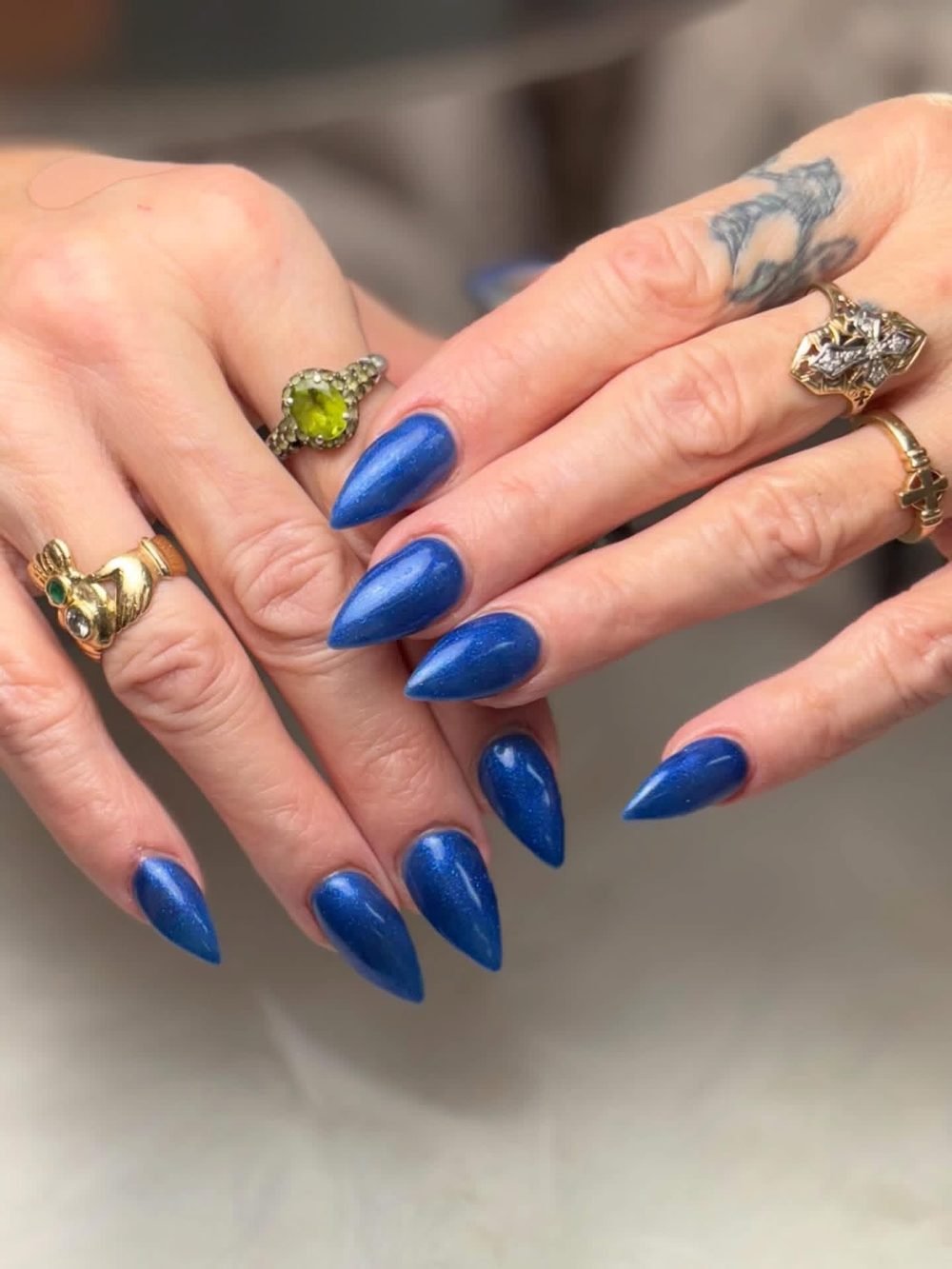 Blue shimmer stiletto nails